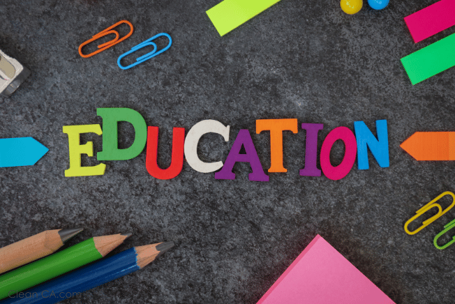 An image featuring vibrant colored stationeries arranged creatively, with lively and playful lettering spelling out the word 'Education'.